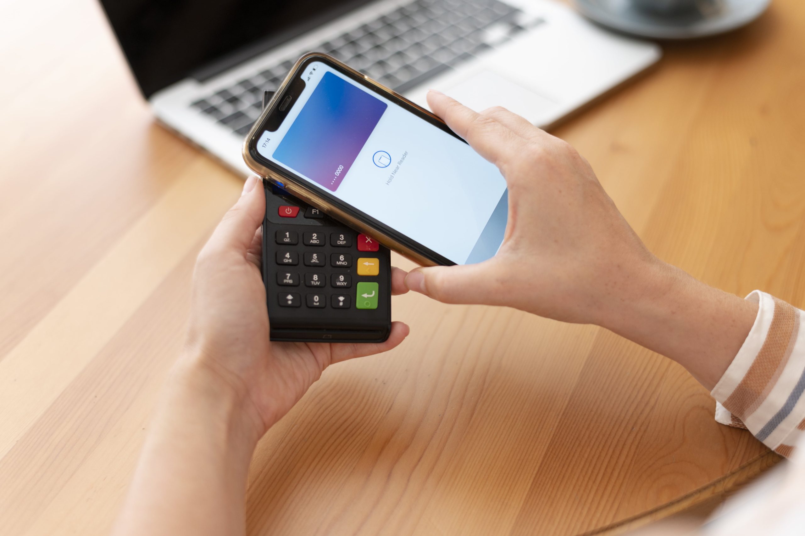 person-paying-with-its-smartphone-wallet-app-min